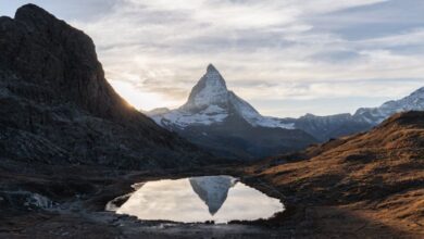 Adventure Trails - Sunset over the Matterhorn's reflection in an alpine lake near Zermatt, Switzerland.