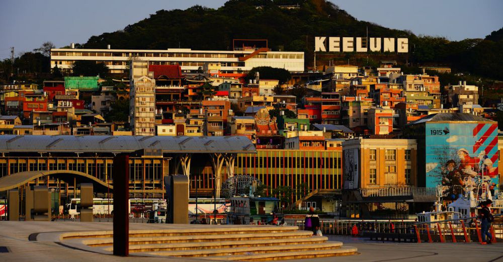 Scenic Locations - A vibrant cityscape of Keelung, Taiwan showcasing colorful buildings at sunset.