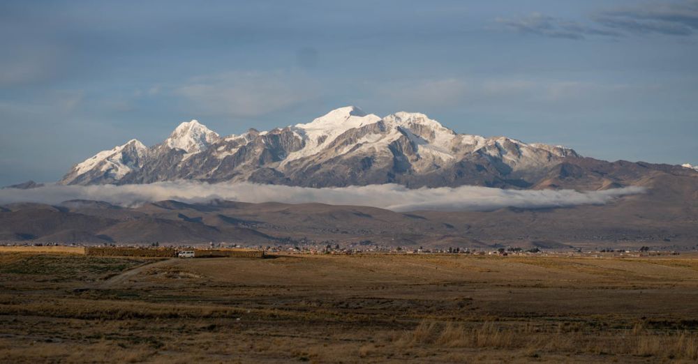 Glacier Photography - Scenic view of Illimani Mountain with snow caps under a clear sky in La Paz, Bolivia.