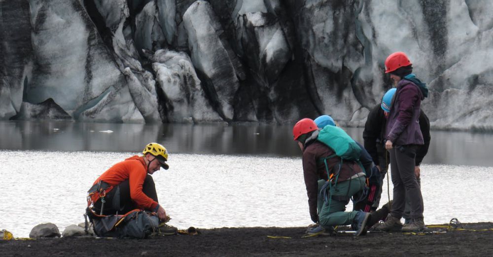 Hiking Glacier Tour - Group of climbers preparing for glacier hike at Vík í Mýrdal, Iceland.