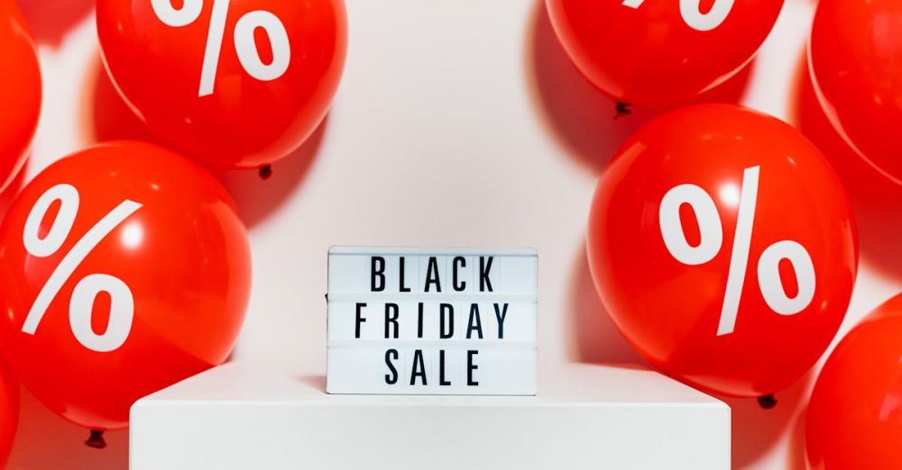 Deals - Red balloons with percentage symbols flank a Black Friday Sale sign, creating a festive shopping atmosphere.