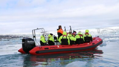 Photography Glacier Tours - Group enjoying thrilling Zodiac boat ride amidst Iceland's icy landscape.