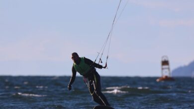Vancouver Surfing - A kitesurfer rides the waves in Vancouver, capturing the essence of adventure sports.