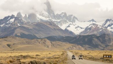 Stunning Destinations - Discover the breathtaking landscape of El Chaltén with Mount Fitz Roy in view as cars journey through this iconic region.