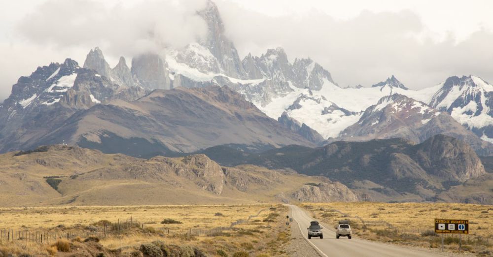 Stunning Destinations - Discover the breathtaking landscape of El Chaltén with Mount Fitz Roy in view as cars journey through this iconic region.