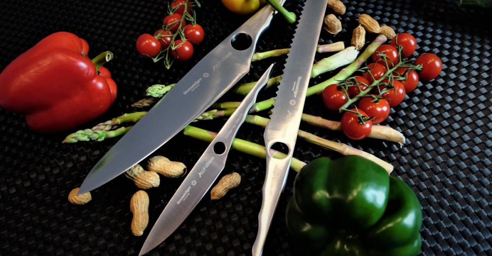 Best Time - A collection of chef's knives with peppers, tomatoes, and peanuts on a black surface.