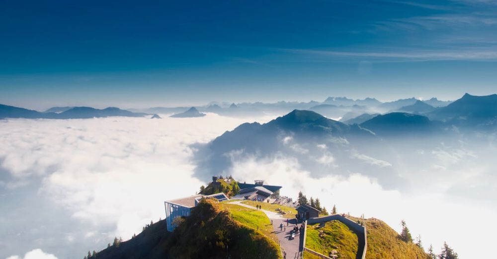 Climbing Trip - A stunning view from Stanserhorn in Switzerland, showcasing clouds, mountains, and scenic landscapes.