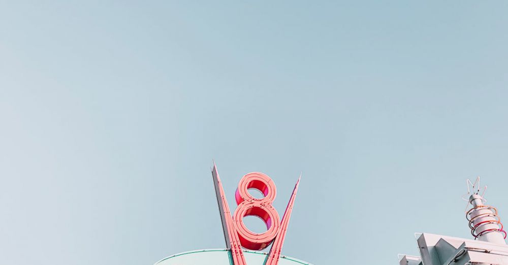 Family Routes - Low angle shot of the iconic Flo's V8 Cafe sign under a clear sky in Disneyland.