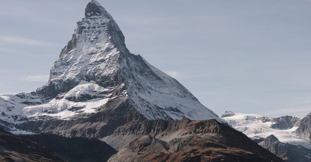 Climbing Photography - Majestic Matterhorn mountain peak in Zermatt, Switzerland, under a clear blue sky.