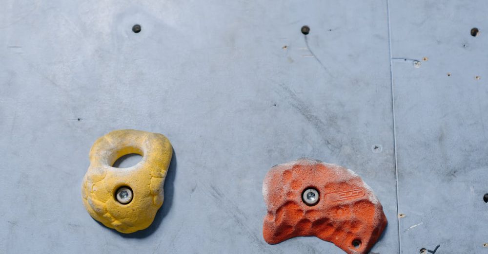 Climbing Fitness - Close-up of colorful climbing holds on a rock wall for sport climbing activity.