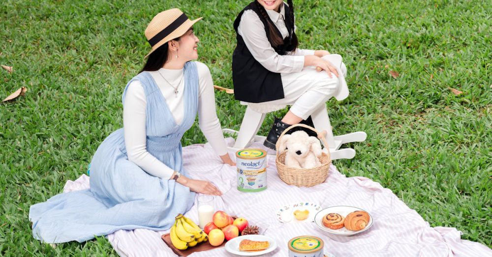 Family Gardens - Delightful outdoor family picnic with mother and daughter in Phnom Penh's green park.