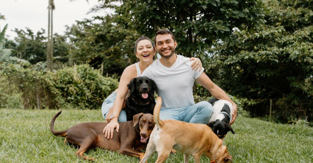 Wildlife Gardens - A joyful couple enjoying outdoors with their dogs in lush Costa Rica.