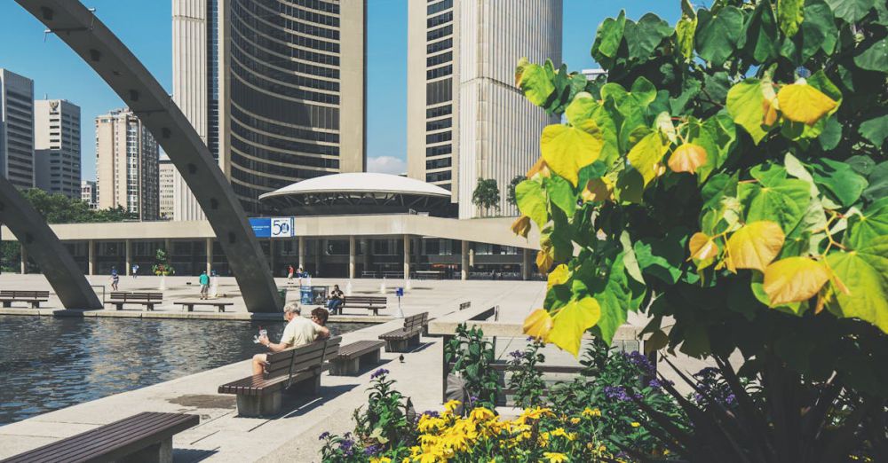 Ontario Gardens - Beautiful view of Toronto City Hall with a lush garden and summer blue sky.