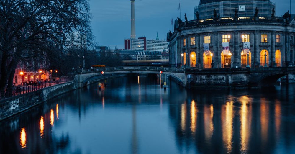 Historical Museums - Dramatic evening view of Berlin's Fernsehturm and Bode Museum reflecting in the Spree River.