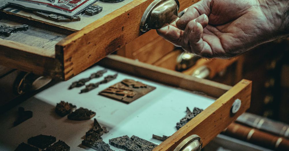 Museum Artifacts - Explore vintage printing artifacts in a wooden drawer, showcasing a glimpse of history and craftsmanship.