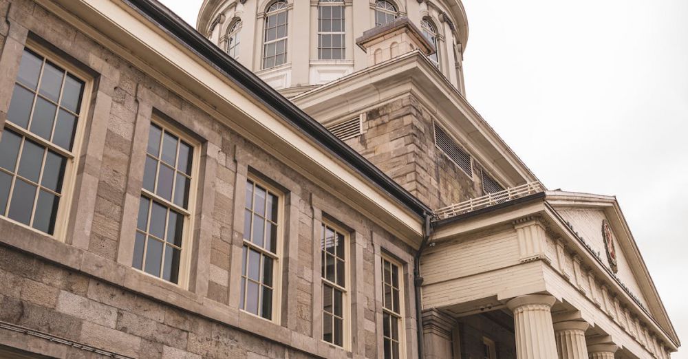 Quebec Museums - Low angle view of the iconic Bonsecours Market and its dome in Montreal.