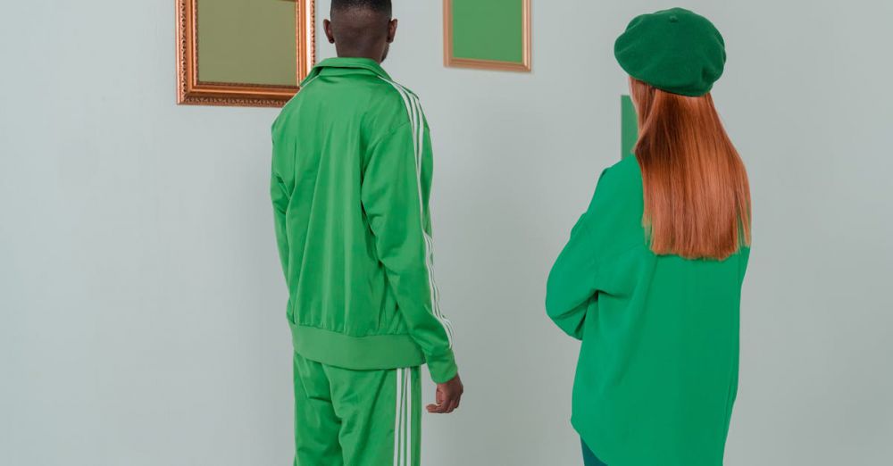 Couple Museums - A man and woman admire art in a minimalist, green-themed gallery setting.