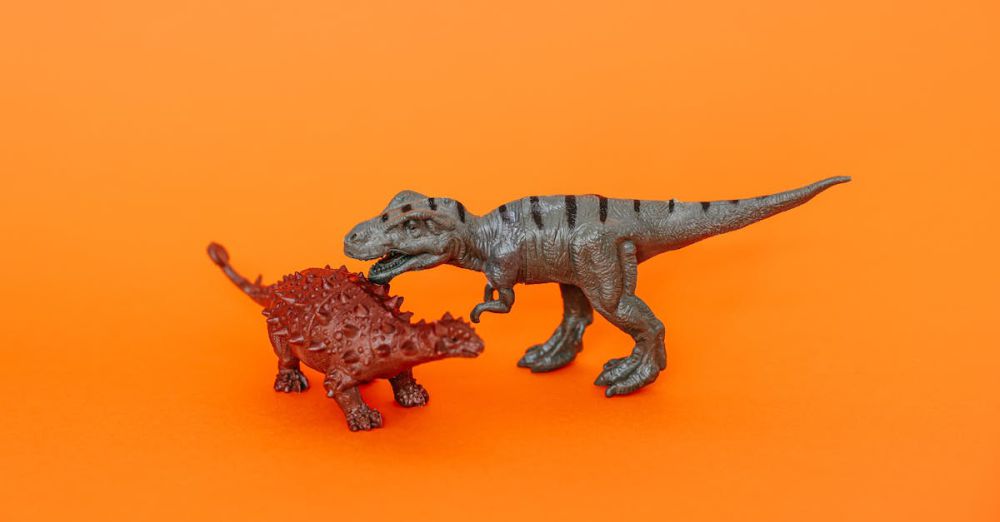 Kids Museums - Two miniature dinosaur toys on a vibrant orange background.