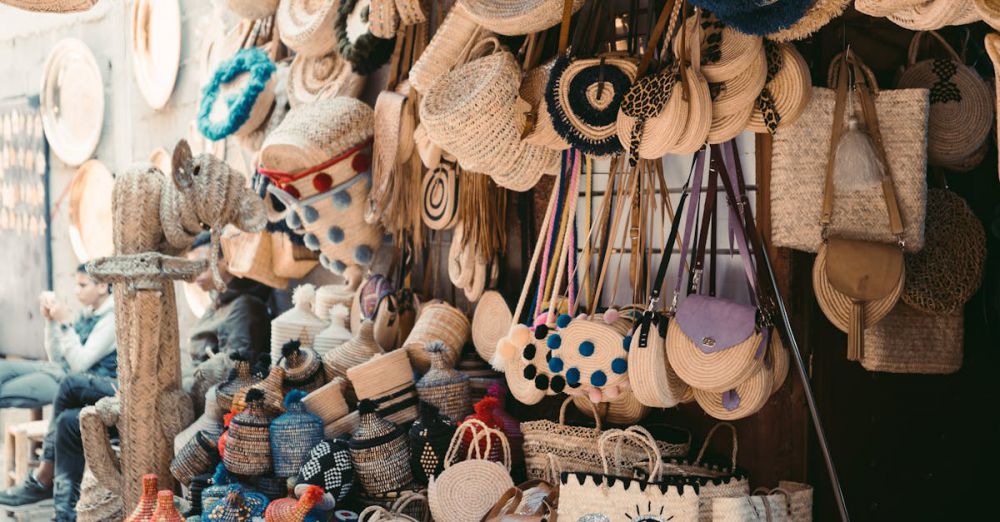 Unique Gifts - Vibrant display of handmade woven bags and hats in a Marrakesh street market.