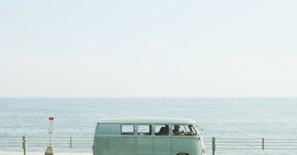 Road Trip Playlist - A classic Volkswagen van driving on a seaside road in Fujisawa, Japan, capturing a nostalgic coastal vibe.