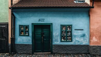 Small Town Road Trips - Colorful facade on Golden Lane in Prague, showcasing historical architecture and cobblestone path.