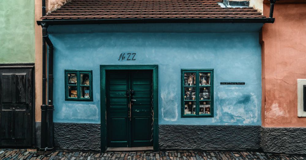 Small Town Road Trips - Colorful facade on Golden Lane in Prague, showcasing historical architecture and cobblestone path.