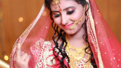 Cultural Festivals - Beautiful Indian bride in traditional red saree and gold jewelry, exuding grace and elegance.