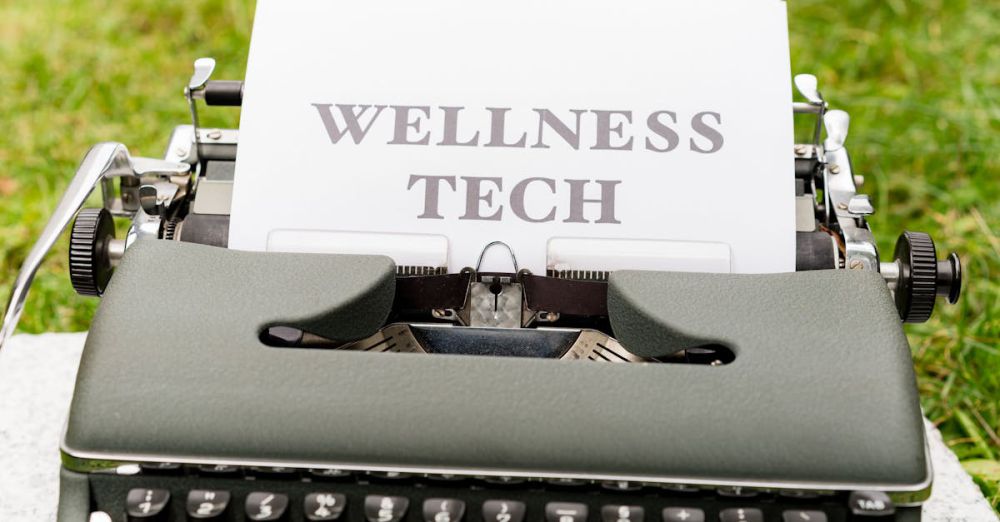 Fitness Trackers - A retro typewriter outdoors displaying a 'Wellness Tech' message on paper.