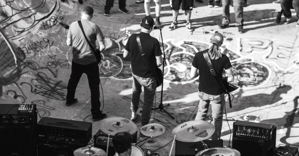 Alternative Music - Dynamic live band performance in an urban skatepark, captured in black and white.