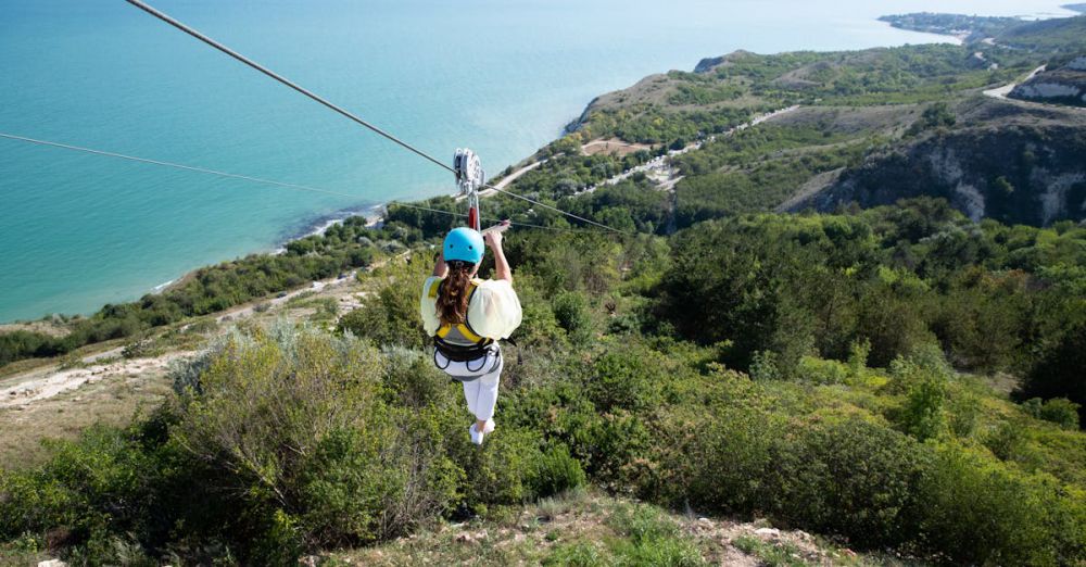 Zip Lining Safety - Experience the thrill of zip lining over a beautiful coastal landscape in Bulgaria.