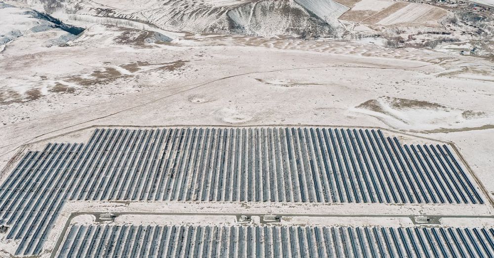 Rockies Zip Lining - Expansive solar farm set against the stunning Altai Mountains in Russian landscape.