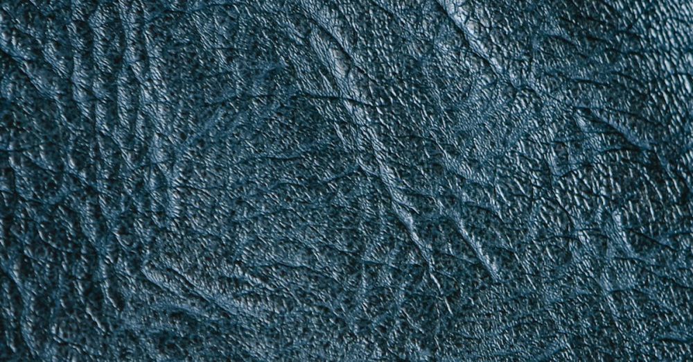 Nature Zip Lining - Detailed close-up of a textured blue leather surface showing intricate patterns.