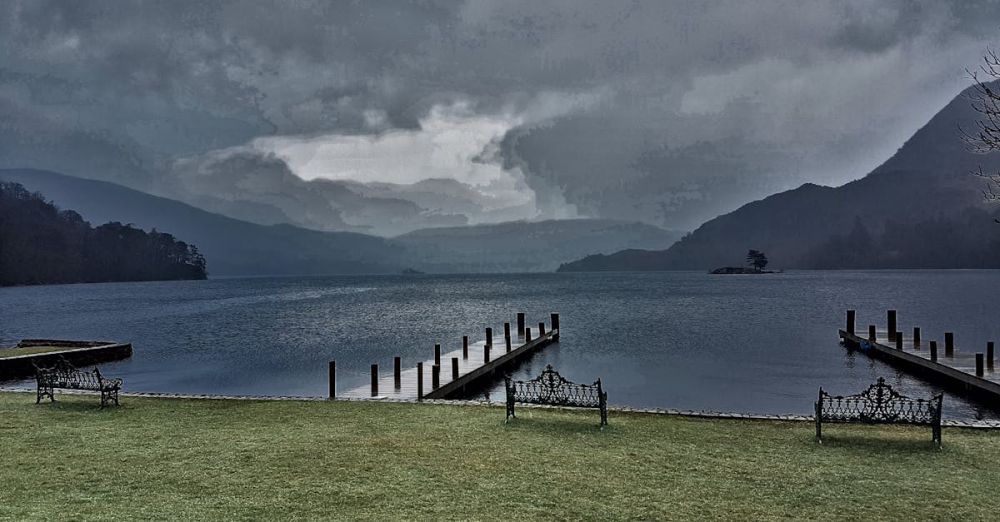 Fishing Spots - Peaceful lakeside view in Cumbria, UK, featuring benches and docks under a dramatic sky.