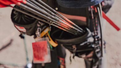 Hunting Locations - Close-up view of arrows and quiver on an archery range, focusing on archery gear and outdoor setup.