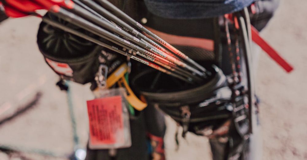 Hunting Locations - Close-up view of arrows and quiver on an archery range, focusing on archery gear and outdoor setup.