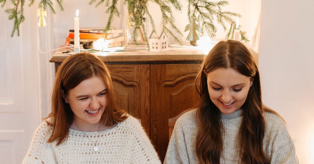 Cooking Gifts - Two women enjoying a cozy indoor holiday celebration with Christmas cookies and gifts.