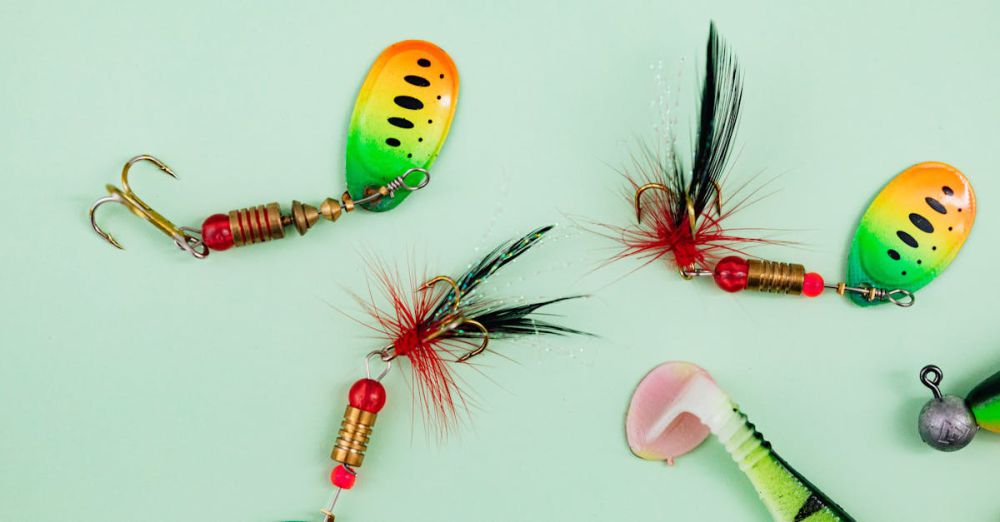 Bass Fishing - Close-up of vibrant fishing lures and hooks on a green backdrop.