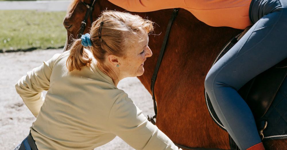 Family Horseback Riding - A woman teaching a young girl horse riding outdoors during the day.