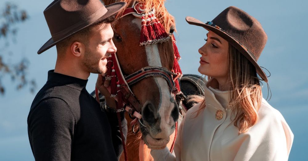 Scenic Horseback Riding - A couple in hats stand with a horse in a picturesque outdoor landscape.