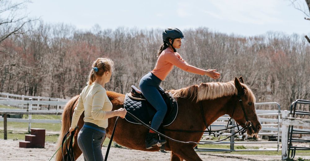 Horseback Riding Instructor - Two women engaged in a horseback riding lesson in an outdoor setting.