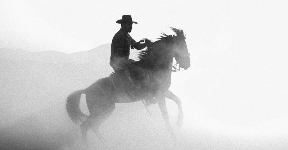 Nature Horseback Riding - A dramatic black and white silhouette of a cowboy riding a horse in a dusty landscape.