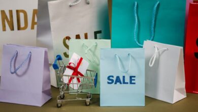 Affordable Gifts - A mix of colorful shopping bags and a small cart displaying a discount gift.