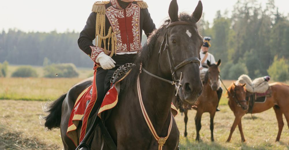 Historical Horseback Riding - Man in historical military uniform on horseback in a scenic field.