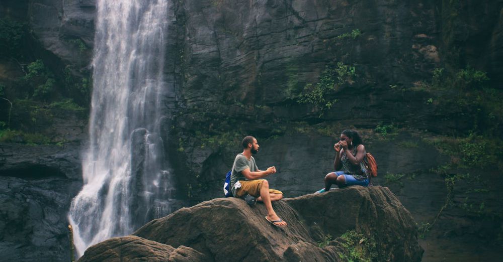 Senior-Friendly Waterfalls - A serene moment captured by a waterfall in India with a couple enjoying nature's beauty together.