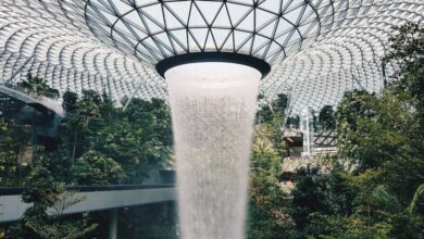 Unique Waterfalls - Stunning view of the indoor waterfall at Jewel Changi Airport, Singapore's architectural marvel.