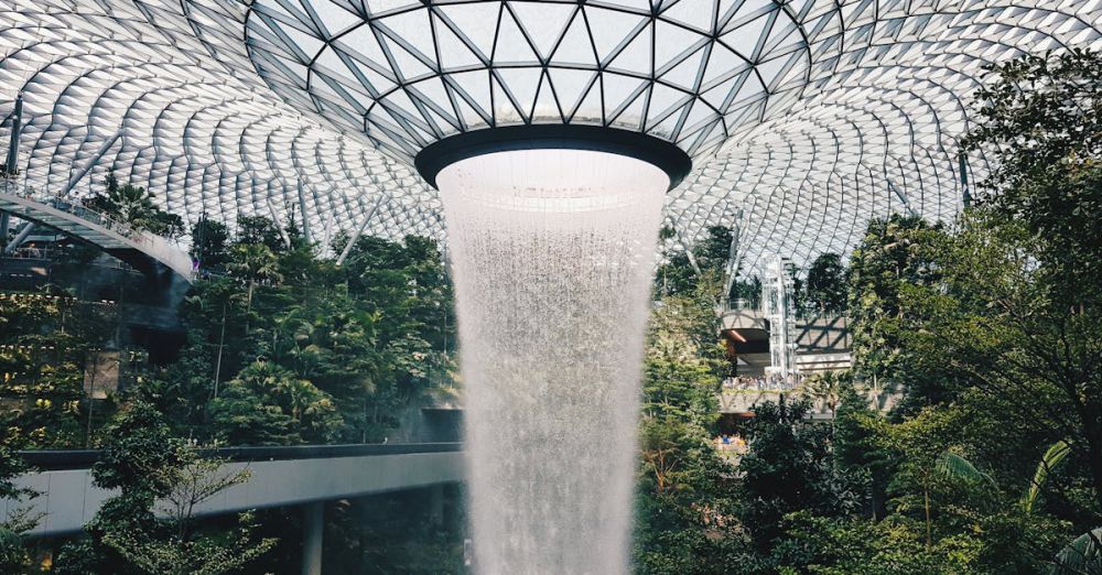 Unique Waterfalls - Stunning view of the indoor waterfall at Jewel Changi Airport, Singapore's architectural marvel.