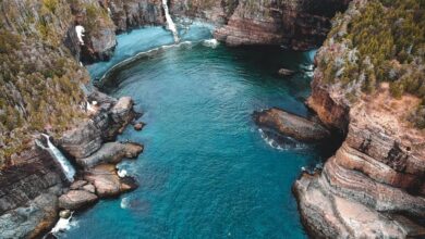 Newfoundland Waterfalls - A breathtaking aerial shot of Flatrock, Canada with cliffs and pristine water.