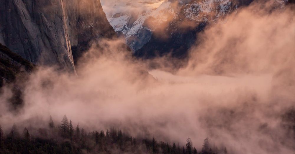 Winter Photography Waterfalls - Breathtaking sunrise over Yosemite Valley with mist and stunning mountain views.