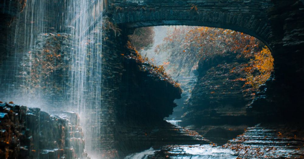 Fall Waterfalls - Tranquil waterfall cascading in a beautiful autumn gorge, perfect for nature lovers.