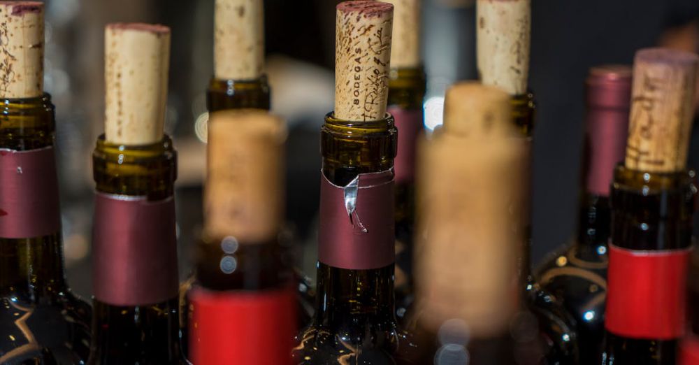 BC Vineyard & Brewery Tours - Close-up view of elegantly corked wine bottles with selective focus. Perfect for wine and lifestyle themes.